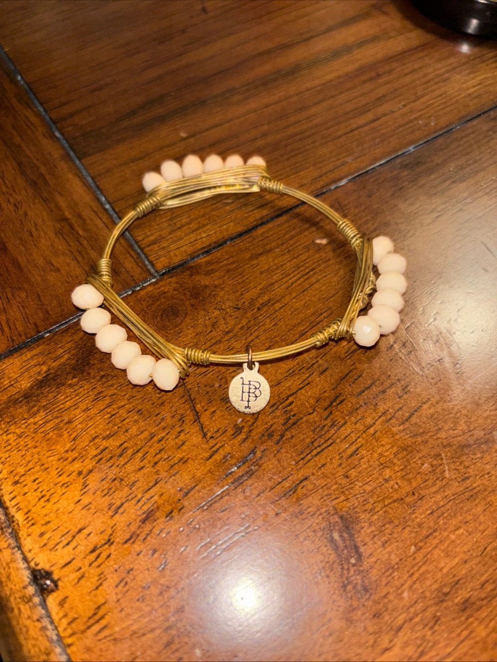 Bourbon And Bowties Gold Tone Wire Wrapped Cream Bracelet 2.5 Inch diameter